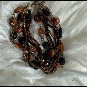 Multiple strand beaded statement bracelet.